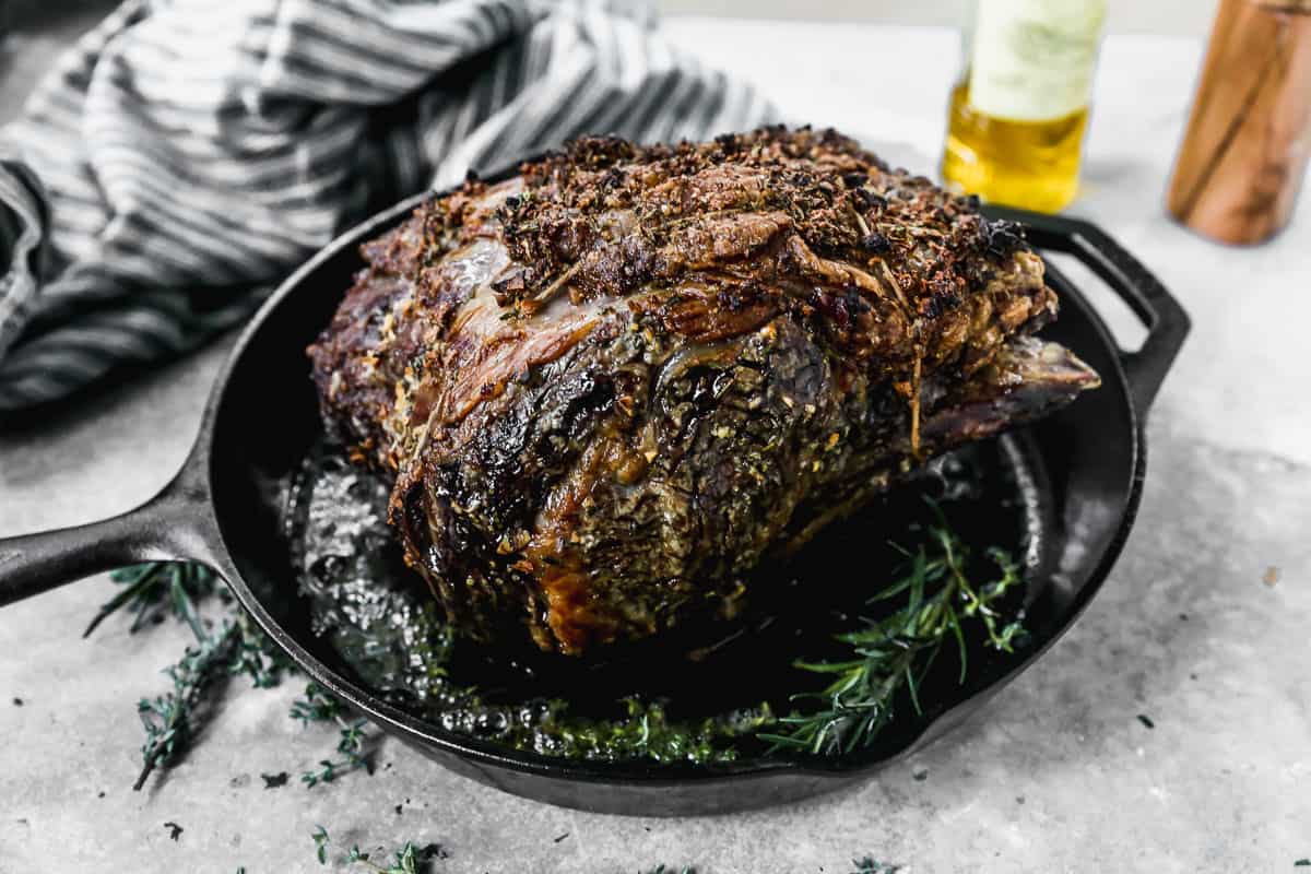 The prime rib fresh out of the oven, showcasing the perfect doneness and inviting crust.